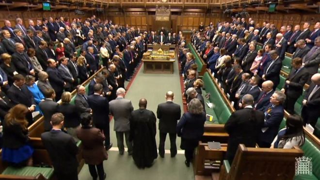 Members of the House of Parliament observe a minute's silence