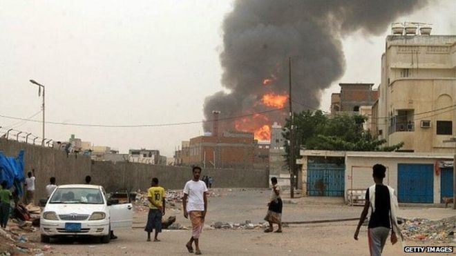 Smoke billows in the city of Aden