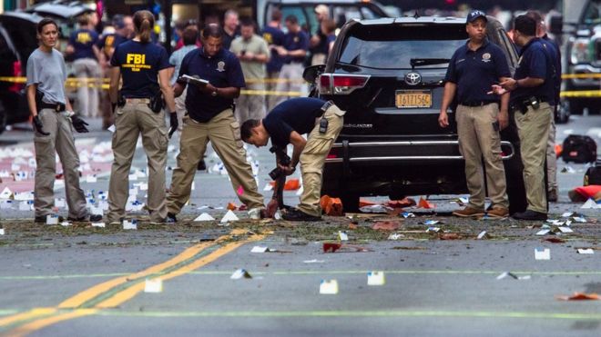 Members of the Federal Bureau of Investigation (FBI) carry on investigations at the scene of Saturday"s explosion on West 23rd Street and Sixth Avenue in Manhattan"s Chelsea neighborhood, New York, Sunday, Sept. 18, 2016.