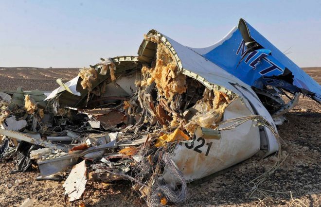 Debris from crashed Russian jet lies on the sand at the site of the crash, Sinai, Egypt, 31 October 2015.