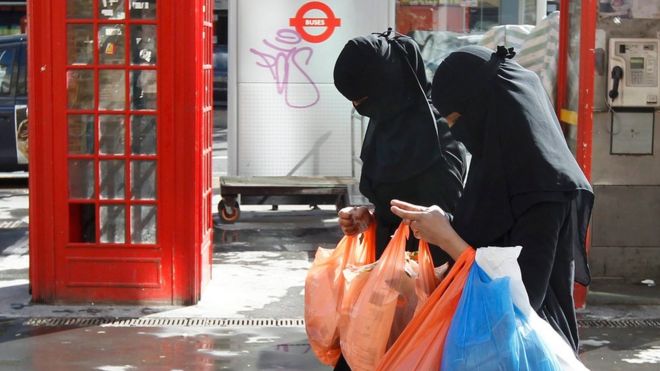 File photo dated 2013, showing two Muslim women shopping in London in full-face veils.