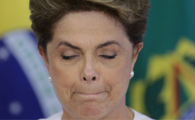 Brazil's President Dilma Rousseff briefly closes her eyes as a governor speaks during a meeting on state land issues, at Planalto presidential palace in Brasilia, Brazil, Friday, April 15, 2016