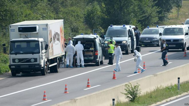 Forensic officers work at a truck inside which were found a large number of dead migrants on a motorway near Neusiedl am See, Austria (August 27, 2015)