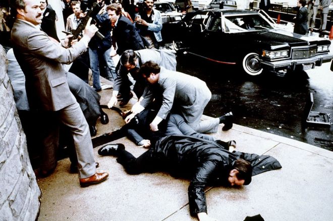 This photo taken by presidential photographer Mike Evens on March 30, 1981 shows police and Secret Service agents reacting during the assassination attempt on then US president Ronald Reagan,