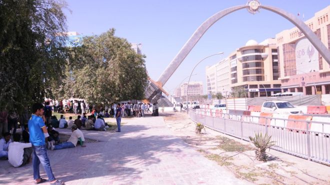 Nepali workers gather at Tarbar Gate in Qatar