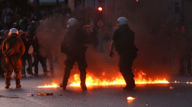Greek riot police disperse protesters