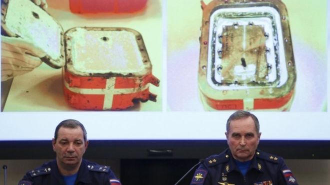 Sergei Bainetov (R), deputy chief of the Russian Armed Forces' flight safety service, and Nikolai Primak, chairman of the Air Accident Investigation Commission, attend a news conference on 21 Dec