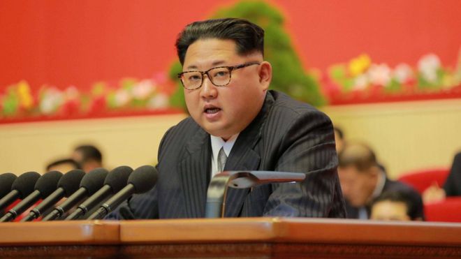 Kim Jong-un speaking from a lecturn
