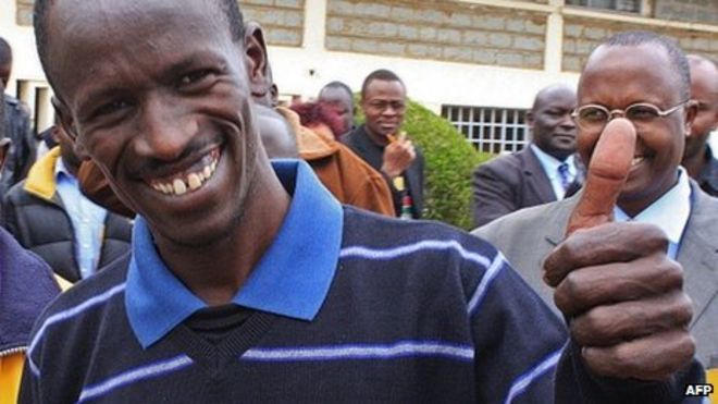 Ezekiel Kemboi gives the thumbs up outside Eldoret court in Kenya on 25 September 2012 - _63656307_63656042