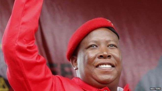 Julius Malema greets Economic Freedom Fighters (EFF) supporters at the launch of its election manifesto in Tembisa township, east of Johannesburg on 22 February 2014