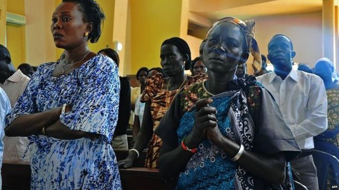People attend a mass in Juba on December 15, 2014 to commemorate one year since the outbreak of the South Sudan civil war