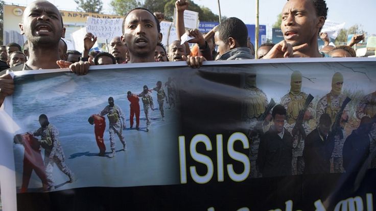Ethiopian demonstrators in Addis Ababa hold a banner during a rally - Wednesday 22 April 2015