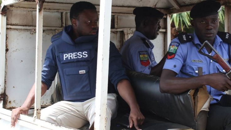 Tomi Oladipo in a car with Nigerian security forces