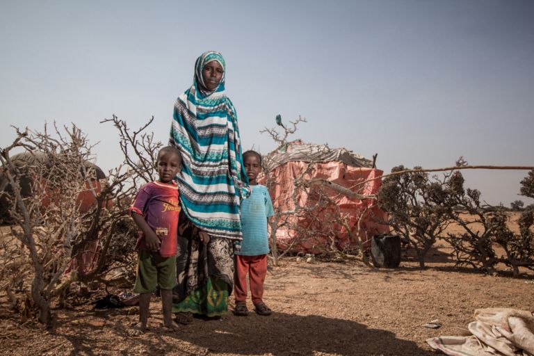 Khadra Mohamed with her twin sons at an informal settlement outside the town of Yogoori