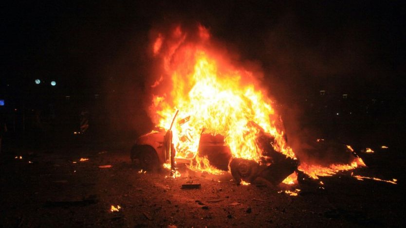 This picture taken on March 13, 2016, shows a burning car after a blast in Ankara. An explosion ripped through a busy square in central Ankara on March 13, killing 27 people and wounding 75 more