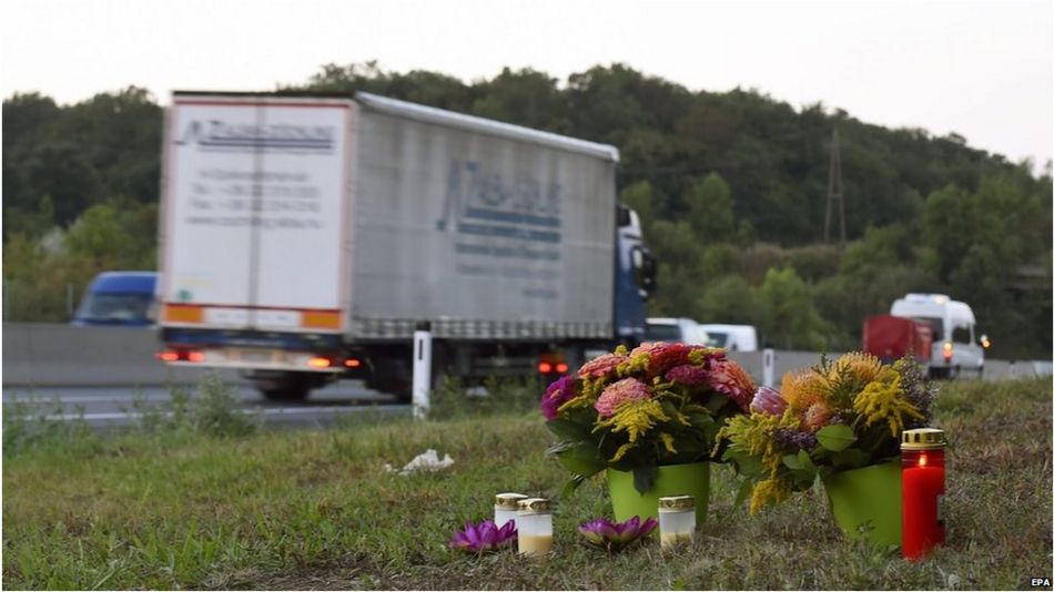Flowers and candles are left by the side of the A4 motorway, in Nickelsdorf
