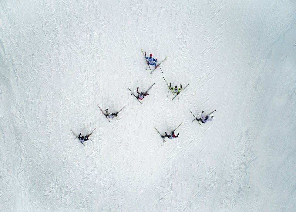 A triangle of skiers from above