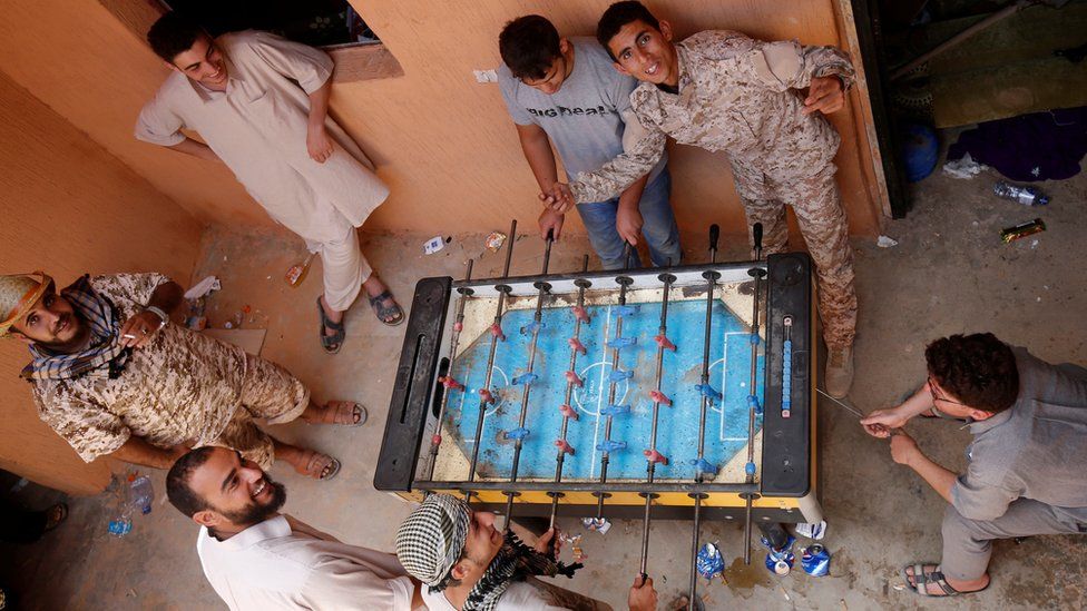 Libyan forces allied with the UN-backed government play table football at the frontline in the western part of Sirte - Tuesday 19 July 2016