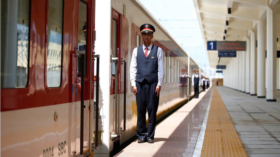Chinese engineers stand in a line near a train at Furi train station near Addis Ababa, Ethiopia - Saturday 24 September 2016
