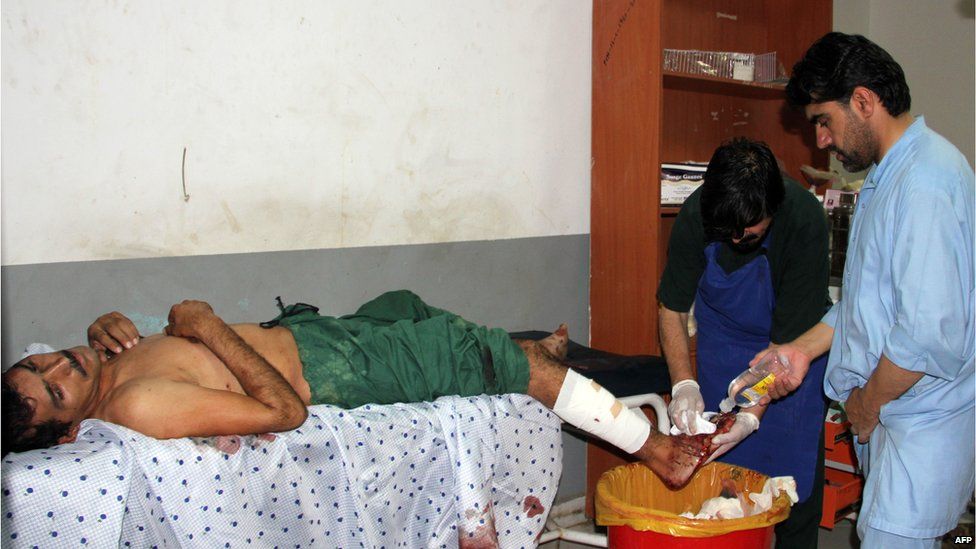 An Afghan man, wounded in a suicide car bomb attack, receives treatment at a hospital in Khost in eastern Afghanistan, 13 July 2015