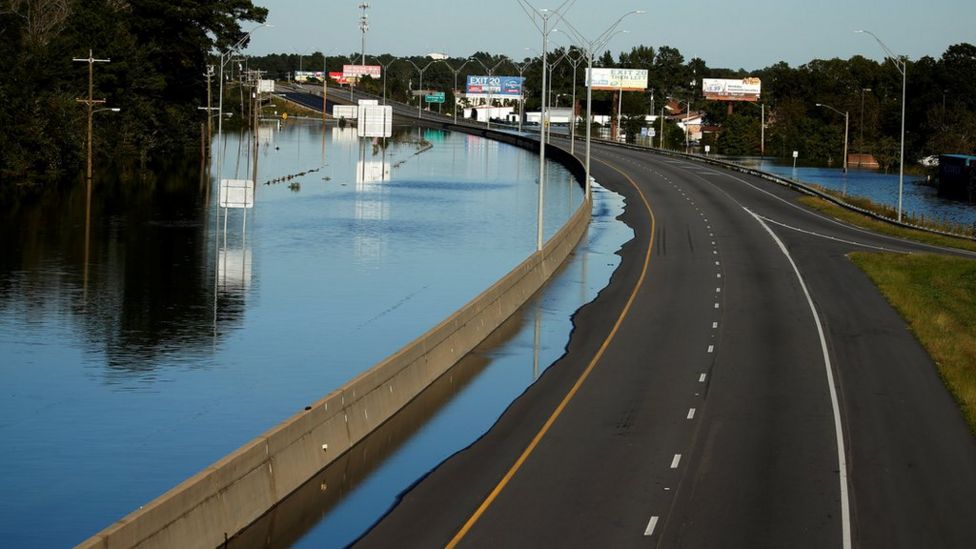 Flooded highway 95 is covered with water as a result of Hurricane Matthew in Lumberton, North Carolina, U.S. October 10, 2016