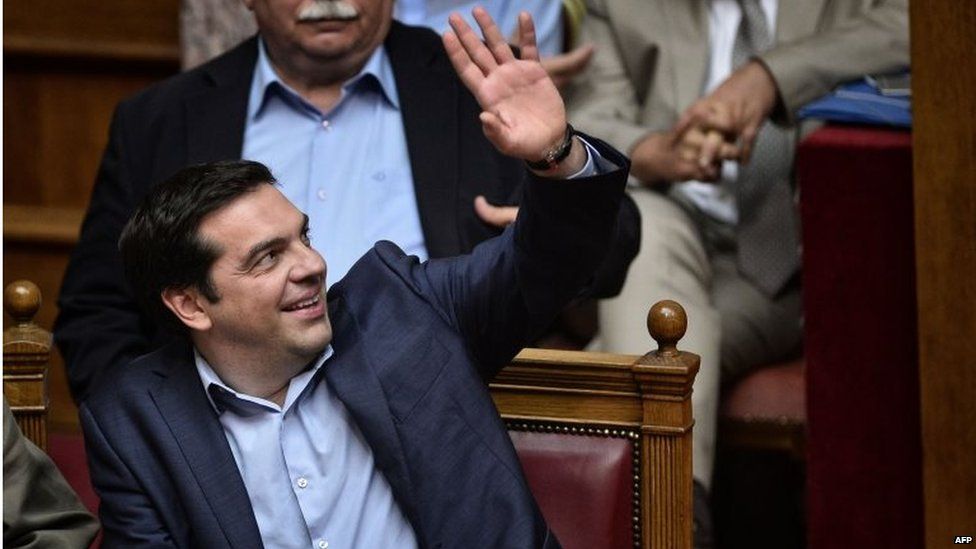 Greek prime minister Alexis Tsipras votes during a session at the Greek parliament in Athens early 23 July 2015