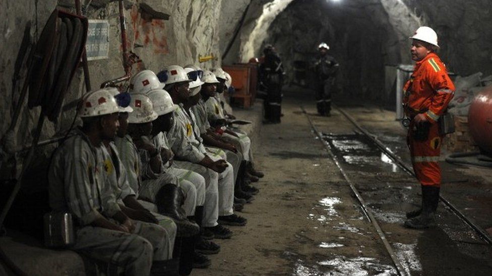 Miners attend a security briefing on October 10, 2013 at the Cullinan Diamond Mine, north-east of Johannesburg.