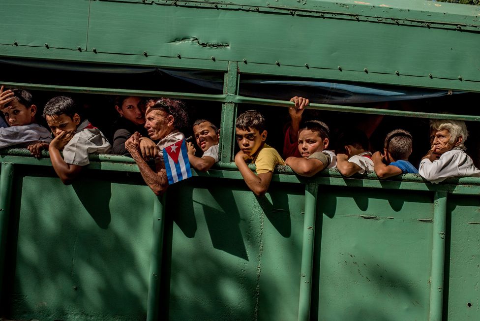 Trucks carry students home after the carriage carrying Fidel Castro's ashes passed in Las Tunas Province, Cuba on 2 December 2016.
