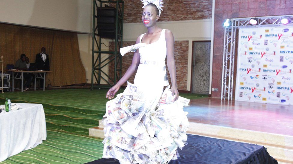 A Ugandan woman wears a paper dress during a beauty contest in Kampala, Uganda - Saturday 24 September 2016