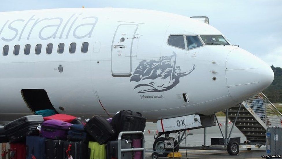 A Virgin Australia plane is seen at a gate at Gold Coast Airport on July 9, 2015 in Gold Coast, Australia. All Virgin Australia flights to Bali have been cancelled due to the impact of a volcanic eruption at Mt Raung.