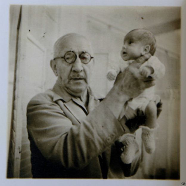 Dr. Martin Couney holding Beth Allen, one of the premature babies who was born in 1941 and participated in his exhibition in Coney Island, New York.