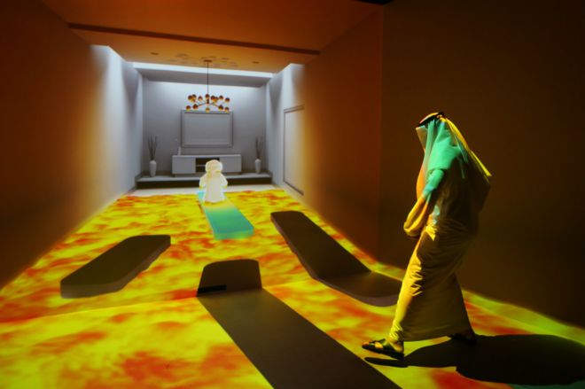 An Emirati man plays at the "Caring Machines" section