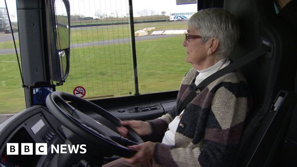 The granny on the bus goes drive, drive, drive! BBC News