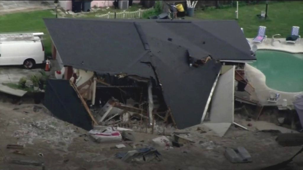 Growing Sinkhole Swallows Two Houses In Florida Bbc News