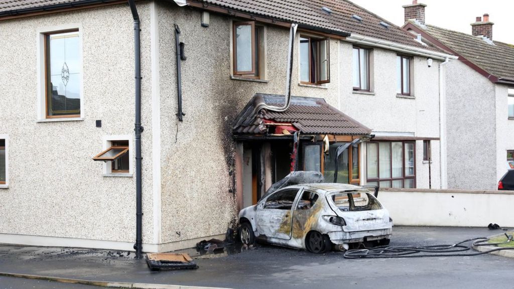 Arrests as car is set on fire outside house in Larne