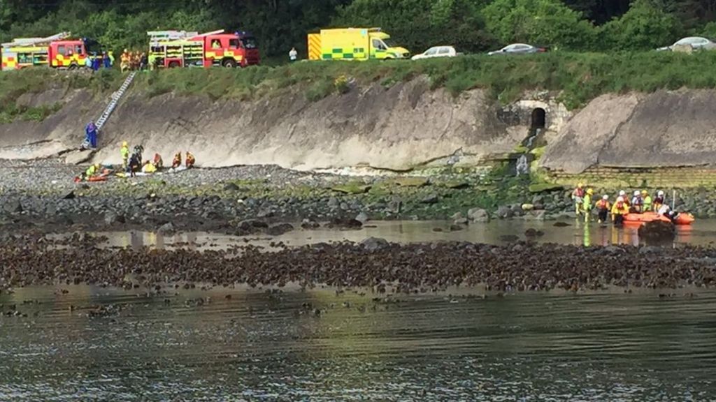 Cyclist falls onto beach from Antrim Coast Road