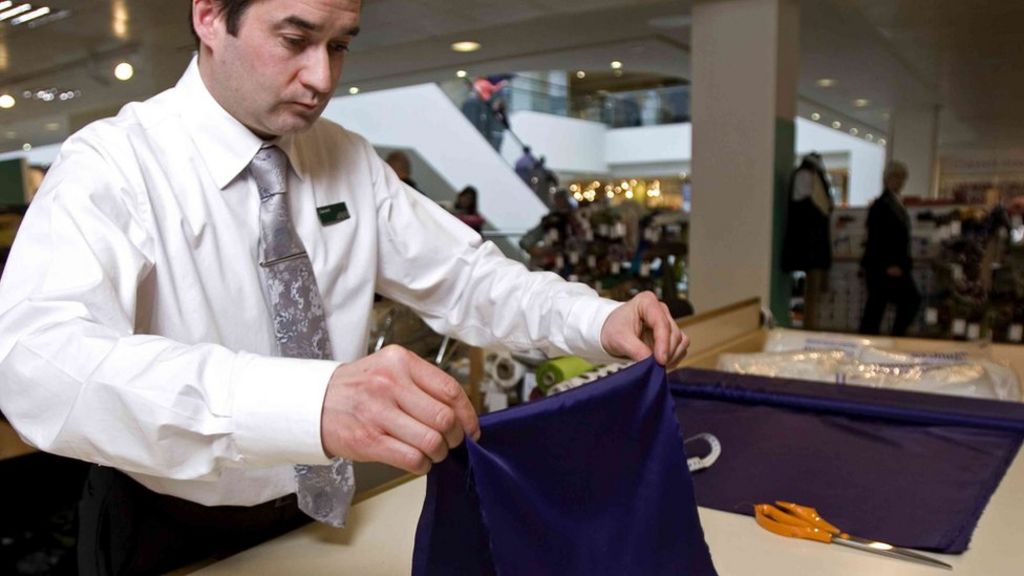 John Lewis profits fall by half BBC News