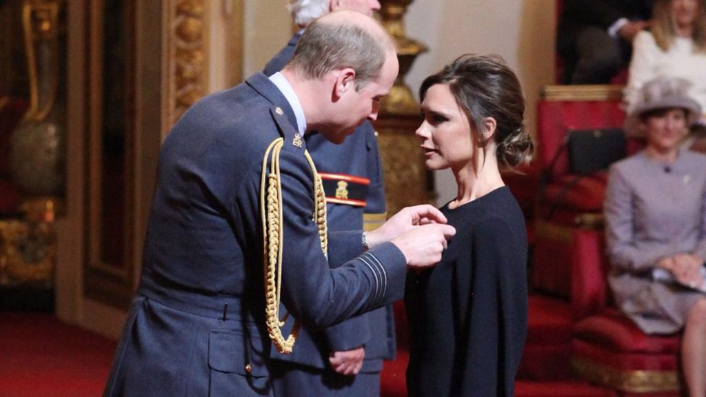Victoria Beckham receives OBE from Prince William