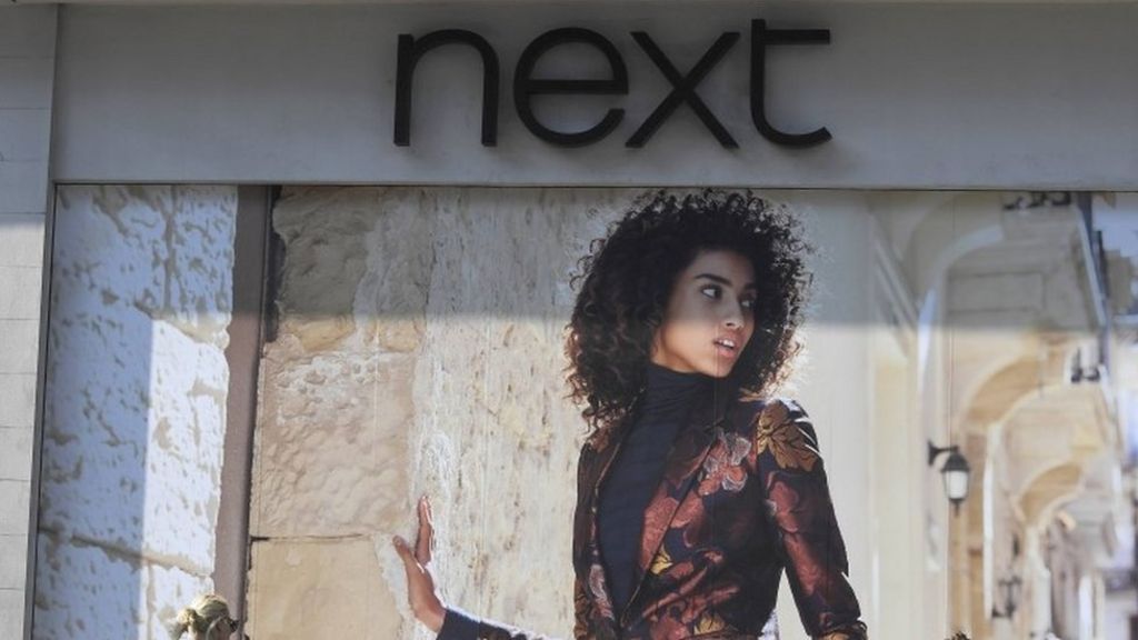 Next shares hit as it cuts profit outlook