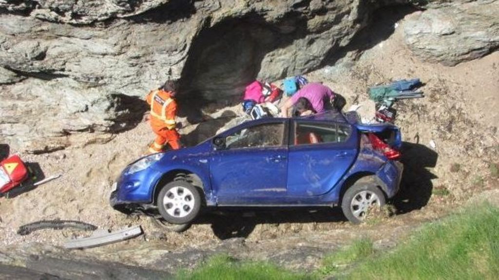 Driver survives 50ft fall over cliff edge