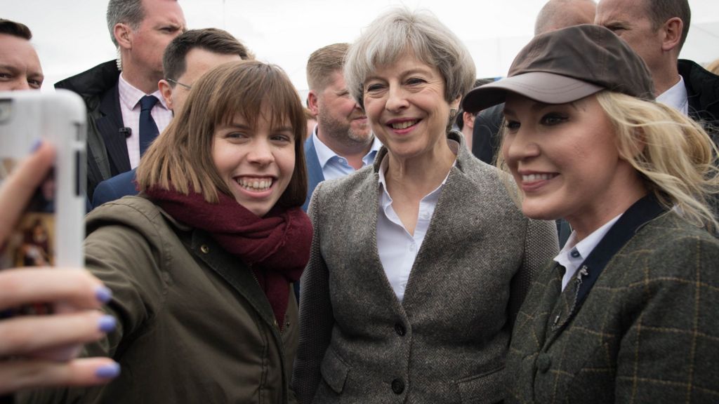 May urges NI leaders to come together