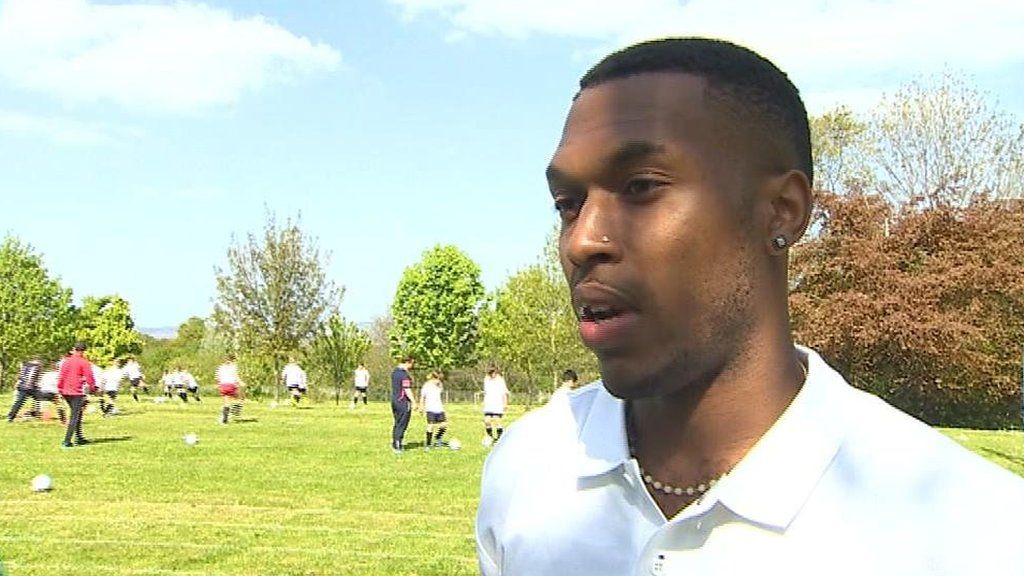 Sturridge delivers new sports equipment to burgled school