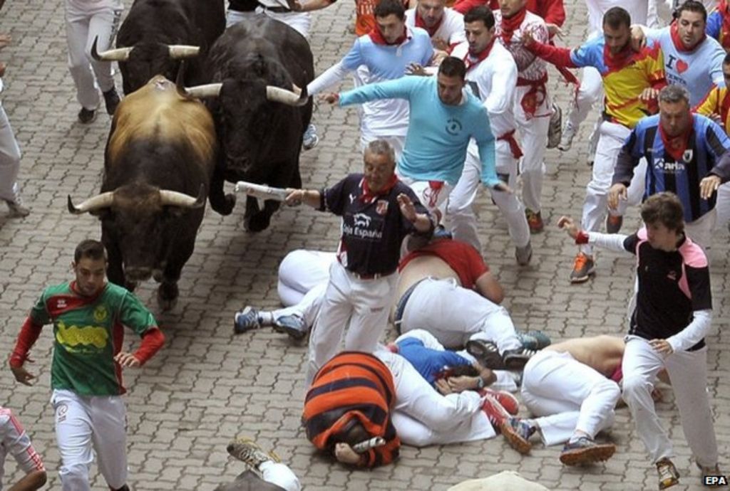 Two men gored in Spain's Pamplona bull run - BBC News