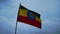 The Ethiopian flag is pictured during a candle lit vigil in Meskal square, in Addis Ababa on August 31, 2012. Tens of thousands of people returned to the square for a second day as they braved rainy conditions to mourn Ethiopian Prime Minister Meles Zenawi who died on August 20, 2012