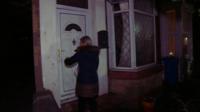 Woman outside house