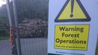 Warning sign and logs