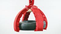 A soft robot lifting a car tyre