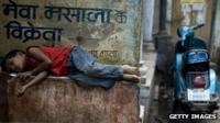 Indian child sleeps in the street