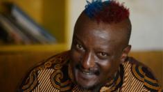 Kenyan author Binyavanga Wainaina smiles during an interview with the AFP on January 27, 2014, in Nairobi