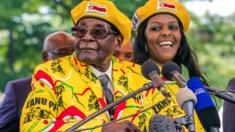 President Robert Mugabe (L) addressing party members and supporters gathered at his party headquarters to show support to Grace Mugabe (R) becoming the party's next Vice President after the dismissal of Emerson Mnangagwa. 8 November 2017